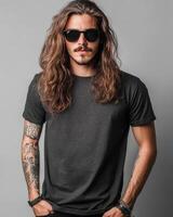 Handsome model in a blank t-shirt poses confidently with long hair photo