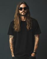 A confident model displays a chic blank t-shirt against a dark backdrop photo