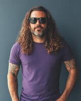 Model poses confidently in a blank t-shirt with sunglasses and striking long hair photo