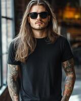 Stylish model showcases a blank t-shirt while striking a confident pose indoors photo