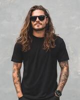 A stylish model stands confidently in a blank t-shirt under bright sunlight photo