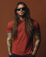 Model flaunts a blank t-shirt with confidence against a warm backdrop photo
