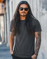 Handsome model poses confidently in a blank t-shirt on a city street photo