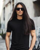 Model exudes confidence while wearing a basic black t-shirt in a city backdrop photo