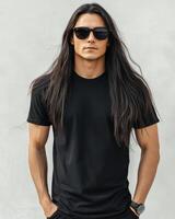 Model with long hair wearing a plain t-shirt strikes a cool pose outdoors photo