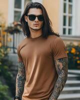 A handsome model with long hair poses in a blank t-shirt and sunglasses photo