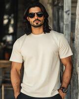 A handsome model presents a casual blank t-shirt with a relaxed attitude photo