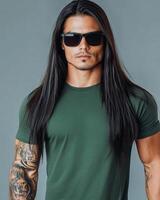Handsome model poses confidently in a blank t-shirt and sunglasses photo