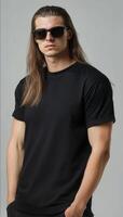 Model with long hair poses confidently, displaying a plain t-shirt effortlessly photo
