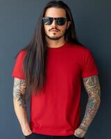 A confident model wearing a plain red t-shirt and stylish sunglasses photo