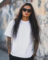 Model displays a blank t-shirt with confidence and a cool demeanor photo