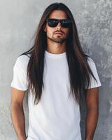 A stylish model showcases a plain t-shirt with long hair and sunglasses photo