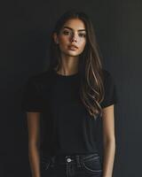 A female model displays a versatile blank black t-shirt with confidence photo