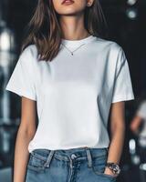 Model wears a blank white t-shirt and jeans in a stylish urban environment photo