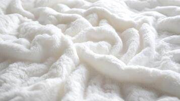 Soft, textured blanket rests gently, inviting comfort and warmth into the space photo