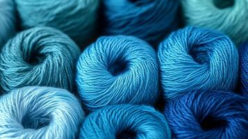 Soft blue yarn rolls create a textured display in a crafting space photo