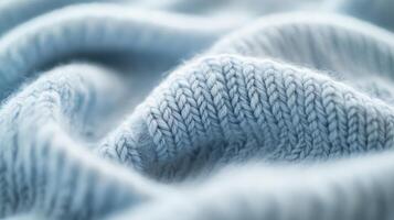 A delicate blue textile showcases intricate patterns and inviting softness photo