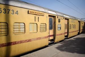 Delhi, India, June 09 2024 - Indian railway express train at departure from Anand Vihar railway station during morning time, Colourful Express train at Delhi railway station photo