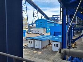 Steam power plant whose building is blue under the blue sky in PLTU Paiton on June 06, 2024 photo