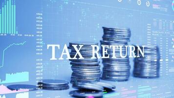 tax return text on coins stack increase with business data hologram. business growth concept. video
