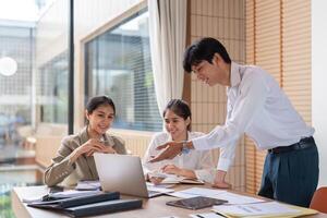 Business Team Collaborating on Work Plans During a Meeting in a Modern Office Setting photo