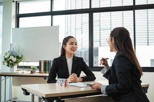 Real Estate Agents Discussing Contracts for Buying and Selling a Home in a Modern Office Setting photo