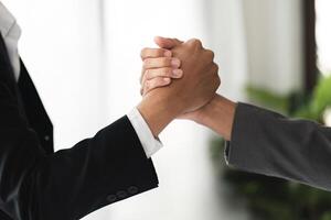 Businessmen Shaking Hands in Agreement, Symbolizing Partnership and Collaboration in a Modern Office Setting photo