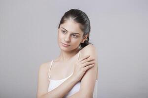 Beautiful Hot Lady Giving Side Pose With One Hand On Her Shoulder photo