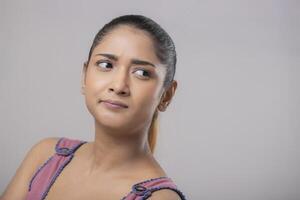 A Beautiful Girl With A Tense Expression On Her Face photo