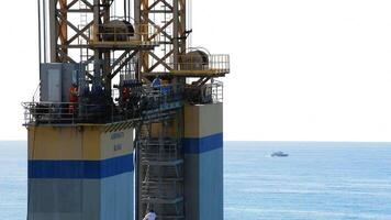 Malaga, Spain, 2017 - Workers in a maritime platform a sunny day video