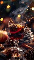 A glass of mulled wine with spices and orange slices. photo