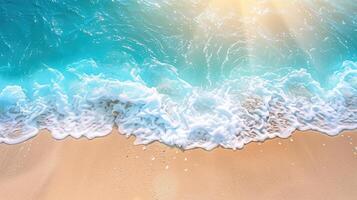 The sun is shining brightly over the ocean. The waves are gently crashing on the shore. The sand is warm and inviting. photo