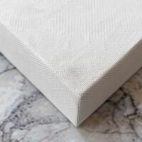 A close up of the corner of a canvas painting. photo