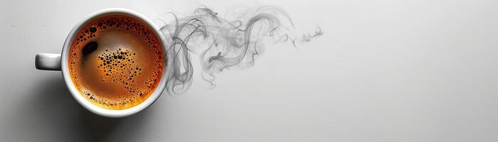 A cup of coffee with smoke rising from it on a white background. photo