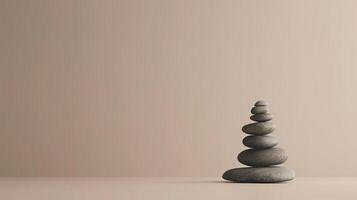 A stack of smooth, round stones stacked in an arch shape against a beige background. photo