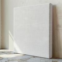 A blank canvas sits on the floor, ready to be painted. photo