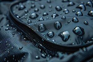 Macro shot of the surface of a waterproof fabric with water droplets on it. photo