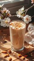 A tall glass of creamy almond milk is the perfect way to start your day. It's delicious, nutritious, and will keep you feeling full and energized for hours. photo