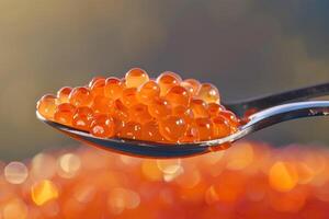 A spoonful of red caviar. photo