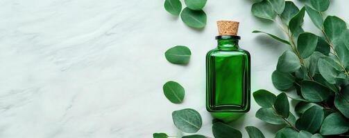 A green glass bottle surrounded by fresh leaves, perfect for showcasing natural oils or herbal elixirs in an elegant setting. photo