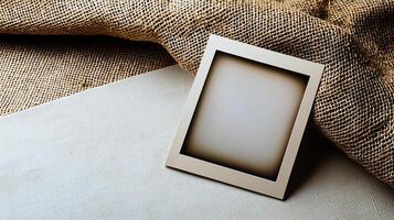 a product shot of a blank polaroid photograph sitting on a blank canvas, birds eye view, professional photograph photo