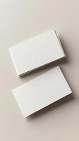 2 blank business cards mockup, view from top, light beige background, atmospheric ambiance photo