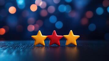 Three colorful stars on a blurred background, depicting creativity and celebration in vibrant hues. photo