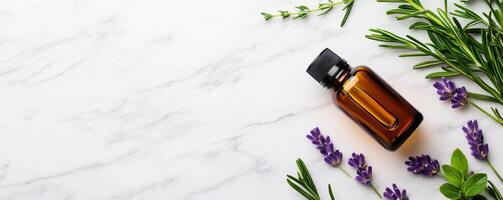 A soothing bottle of essential oil surrounded by fresh herbs and lavender on a light marble surface. photo