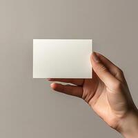 a hand model holding a 5 x 7 inch card, mockup style photo