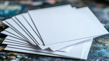 8 pieces of white blank paper scattered on a table photo