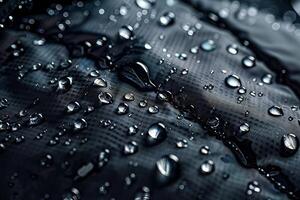 Black fabric with water drops photo