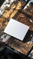 6x9 size white greeting card mockup, top view, weathered wooden table, scenic light photo