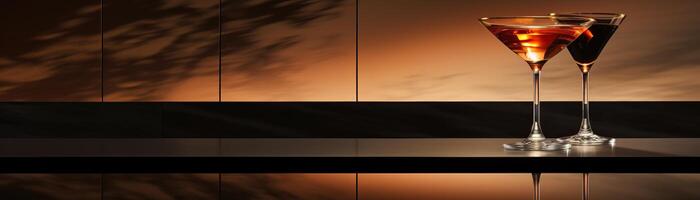 Two martini glasses on a bar with an orange background photo