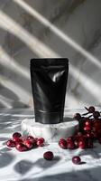 Black matte pouch with red berries. photo